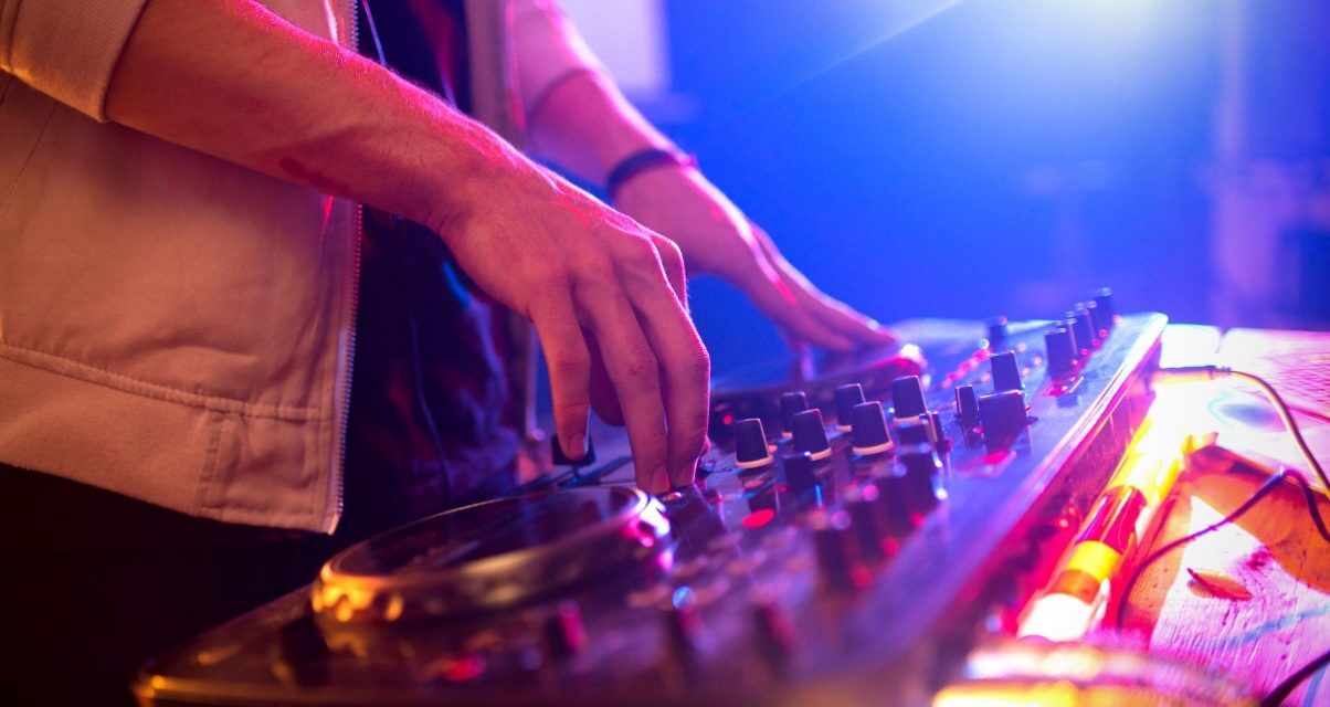 DJ plays a gig on a controller