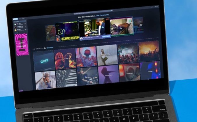 A silver laptop against a sky blue background, displaying various genres and livestreams on DJ-specific streaming platform LFG.TV
