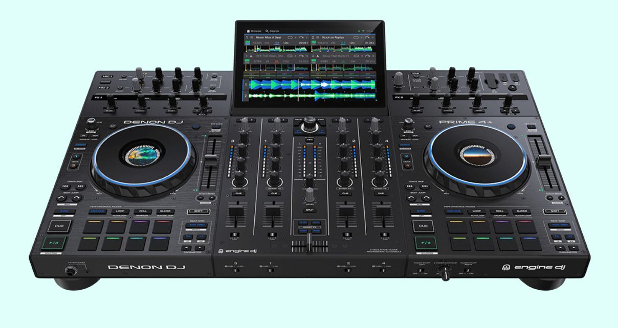 Top angled view of a dark grey Denon DJ Prime 4+ DJ system on a pale blue background