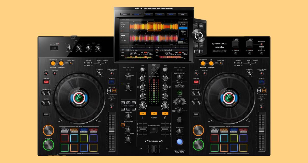 Top down view of a black XDJ-RX3 DJ system on a pale orange background