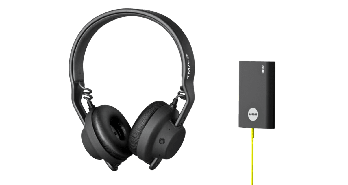 AIAIAI TMA-2 DJ Wireless headphones and transmitter against a transparent background.